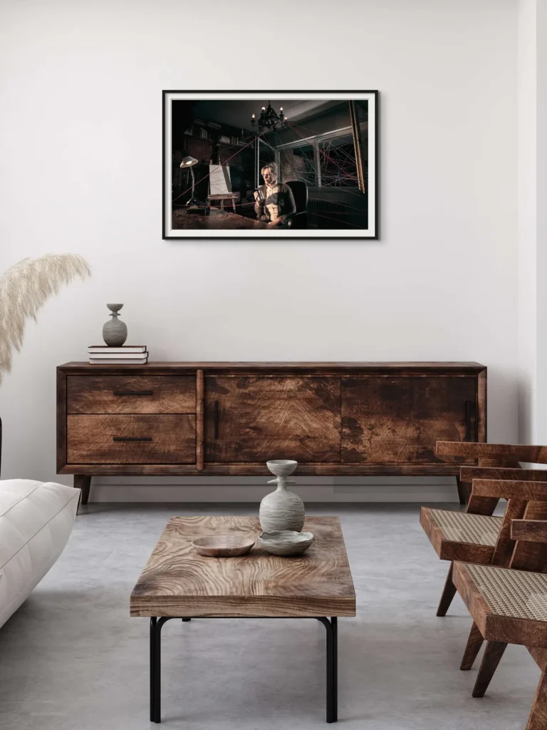 Framed print above a wooden sideboard