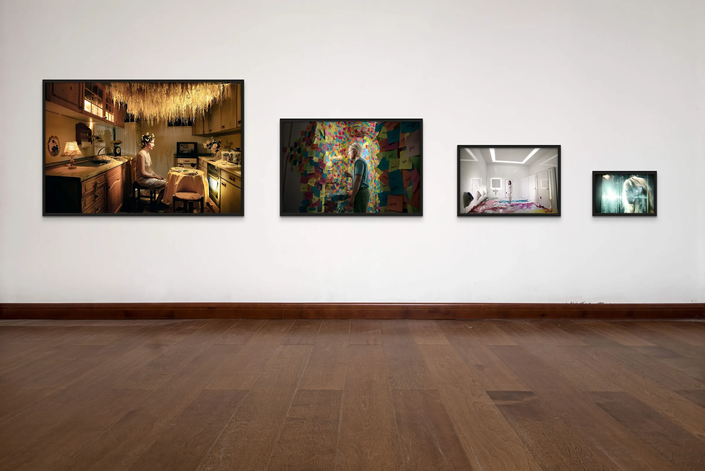 Prints in four sizes on a gallery wall